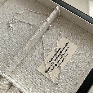Detail of silver S925 square bead necklace with lobster clasp in a premium jewelry box
