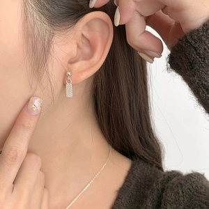 Minimalist S925 sterling silver tassel chain earrings worn by model for daily wear