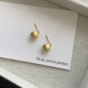 Minimalist S925 sterling silver matte bean stud earrings with a brushed golden finish