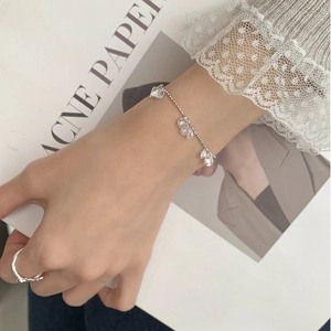 S925 sterling silver bracelet with sparkling cubic zirconia water drop charms on wrist