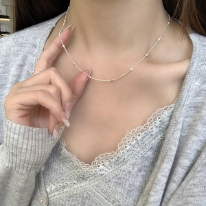 Minimalist S925 sterling silver square bead necklace on model for delicate collarbone look