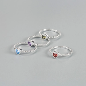 Set of four S925 sterling silver twist rings with colorful heart shaped zircons