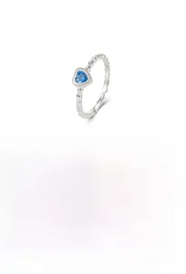 Macro detail of S925 sterling silver twist ring with adjustable band and blue heart gemstone
