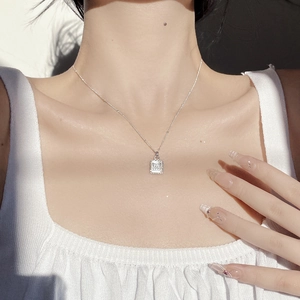 S925 silver butterfly necklace with white shell pendant on model in sunlight