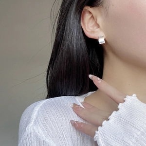 Minimalist square S925 sterling silver hoop earrings with polished mirror finish on model