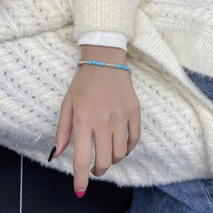 Detail of S925 sterling silver beaded bracelet featuring turquoise cylinders and silver beads