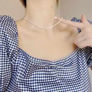 Minimalist S925 sterling silver phoenix tail chain necklace worn on a female neck