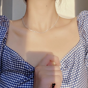Minimalist S925 sterling silver phoenix tail chain necklace worn on a model neckline