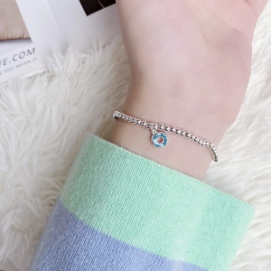 Bracelet élégant en argent sterling S925 perlé avec un pendentif donut en émail bleu
