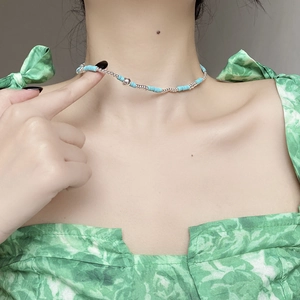 Handmade S925 sterling silver turquoise beaded choker necklace on model neckline