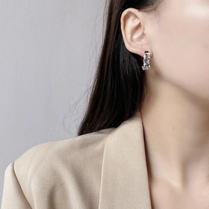 Minimalist 925 sterling silver geometric wavy earrings with textured metallic finish
