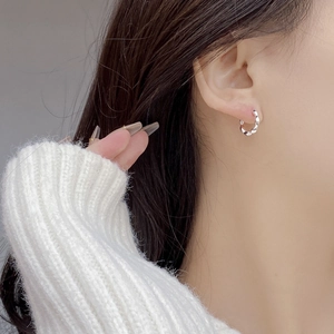Minimalist S925 sterling silver twisted hoop earrings for women with elegant metallic finish