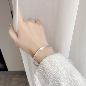 Minimalist 925 sterling silver twisted bangle with matte brushed texture for women