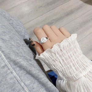 Vintage S925 sterling silver ring with embossed Cupid angel design on finger