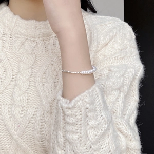 Elegant S925 silver bracelet featuring natural freshwater pearls and crushed silver beads