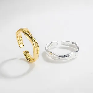 Minimalist S925 sterling silver Mobius rings with gold and silver wavy texture