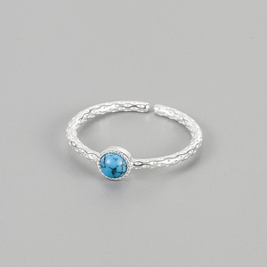 Adjustable S925 sterling silver ring featuring a hammered band and blue turquoise gemstone