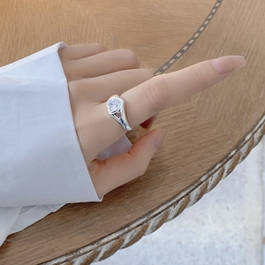 Detailed view of an S925 silver ring featuring a large heart-shaped cubic zirconia stone