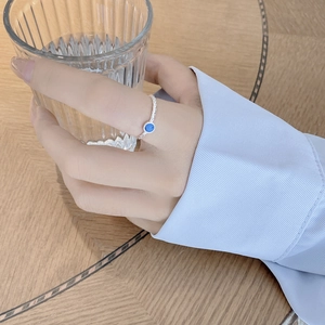 Adjustable S925 sterling silver ring featuring a round blue turquoise and woven texture