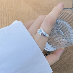 925 silver ring featuring a large heart-shaped zircon on wide band worn by a model