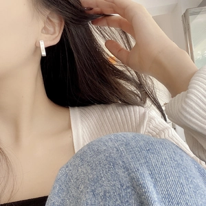 Minimalist S925 sterling silver geometric rectangular stud earring worn on the earlobe