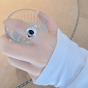 Retro 925 sterling silver ring with oval black agate gemstone shown on finger