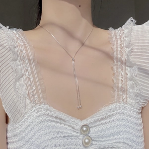 Close-up of adjustable S925 silver Y-shaped snake chain necklace with slider and beads