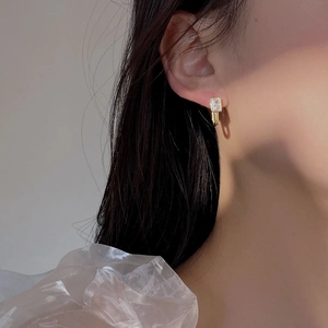 Elegant S925 silver gold-plated geometric square zircon drop earrings worn by a model