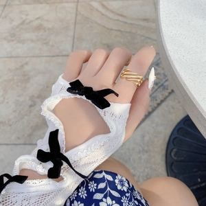 S925 sterling silver geometric hollow ring in gold finish on female hand with lace gloves
