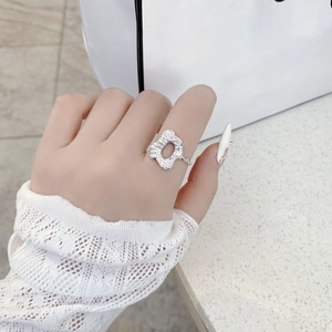 Minimalist 925 sterling silver ring with irregular hammered texture on female index finger