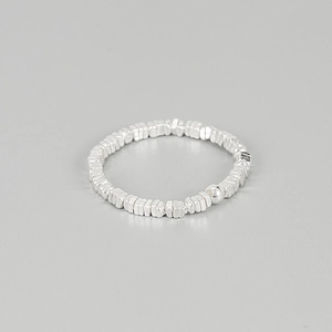 Minimalist 925 sterling silver beaded ring with irregular textures and elastic band