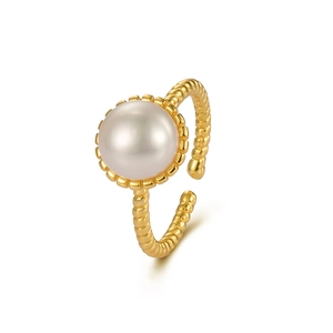 Adjustable gold twist ring featuring a large round freshwater pearl on white background