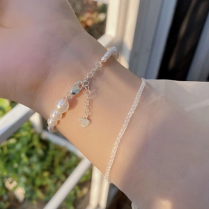 Elegant S925 sterling silver pearl bracelet with heart charm and adjustable chain