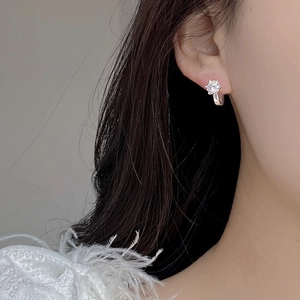 S925 sterling silver hoop earrings with six-prong set clear zircon on model ear
