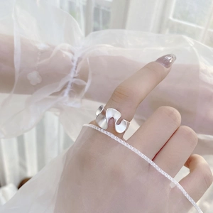 Detailed view of matte S925 sterling silver wavy ring featuring irregular ruffled texture
