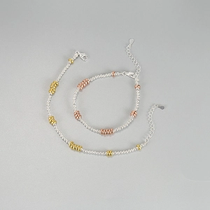925 sterling silver beaded bracelet set with gold and rose gold accents and lobster clasp