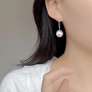 Minimalist S925 sterling silver brushed ball earrings worn by model for stylish look
