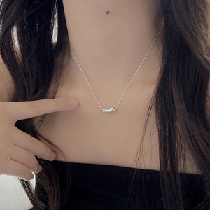 Minimalist 925 sterling silver necklace featuring a custom engraved date bean pendant