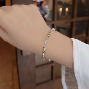 Minimalist 925 silver beaded bracelet for women in two-tone gold and silver design