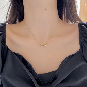 Minimalist 925 sterling silver gold plated pea pendant necklace worn by female model