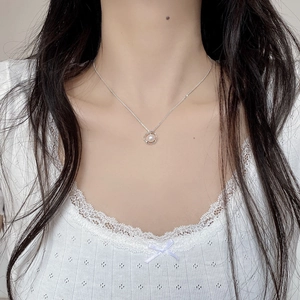 S925 sterling silver necklace with natural freshwater pearl pendant worn by a model
