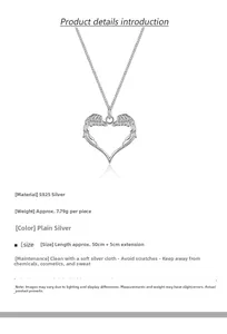 Detail of S925 sterling silver hollow heart and angel wing pendant on long sweater chain