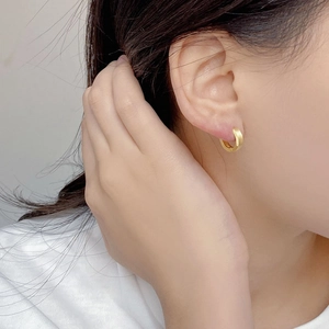 Elegant 925 sterling silver hoop earrings in gold finish with a minimalist brushed texture