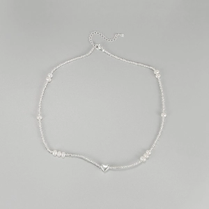 Detailed close-up of S925 sterling silver heart necklace with white pearls and lobster clasp