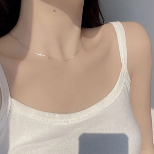 Close-up of minimalist S925 sterling silver bamboo chain necklace on model collarbone