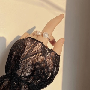 Detailed close-up of S925 silver U-shaped ring with two natural freshwater pearls