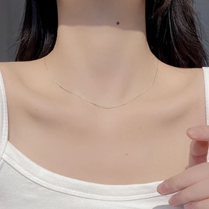 Minimalist S925 sterling silver bamboo chain necklace worn on a woman's collarbone
