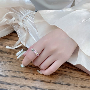 S925 sterling silver ring with colorful heart and square zircon stones on model's finger