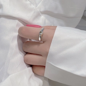 Detail of S925 silver ring with zircons and black star motifs on model's hand