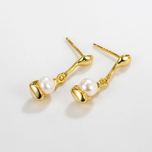 Macro shot of S925 sterling silver stamp on gold irregular pearl stud earrings